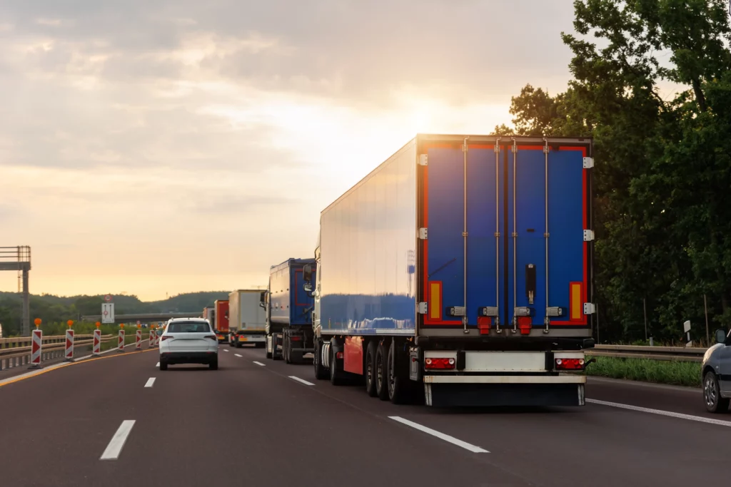 trucks and cars in a highway